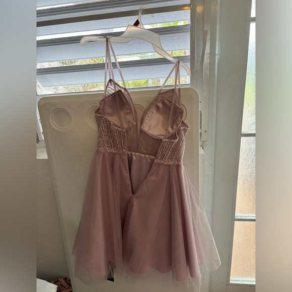 It’s a Mauve short Cinderella dress. Never been used, still has all its tags. - Picture 3 of 4